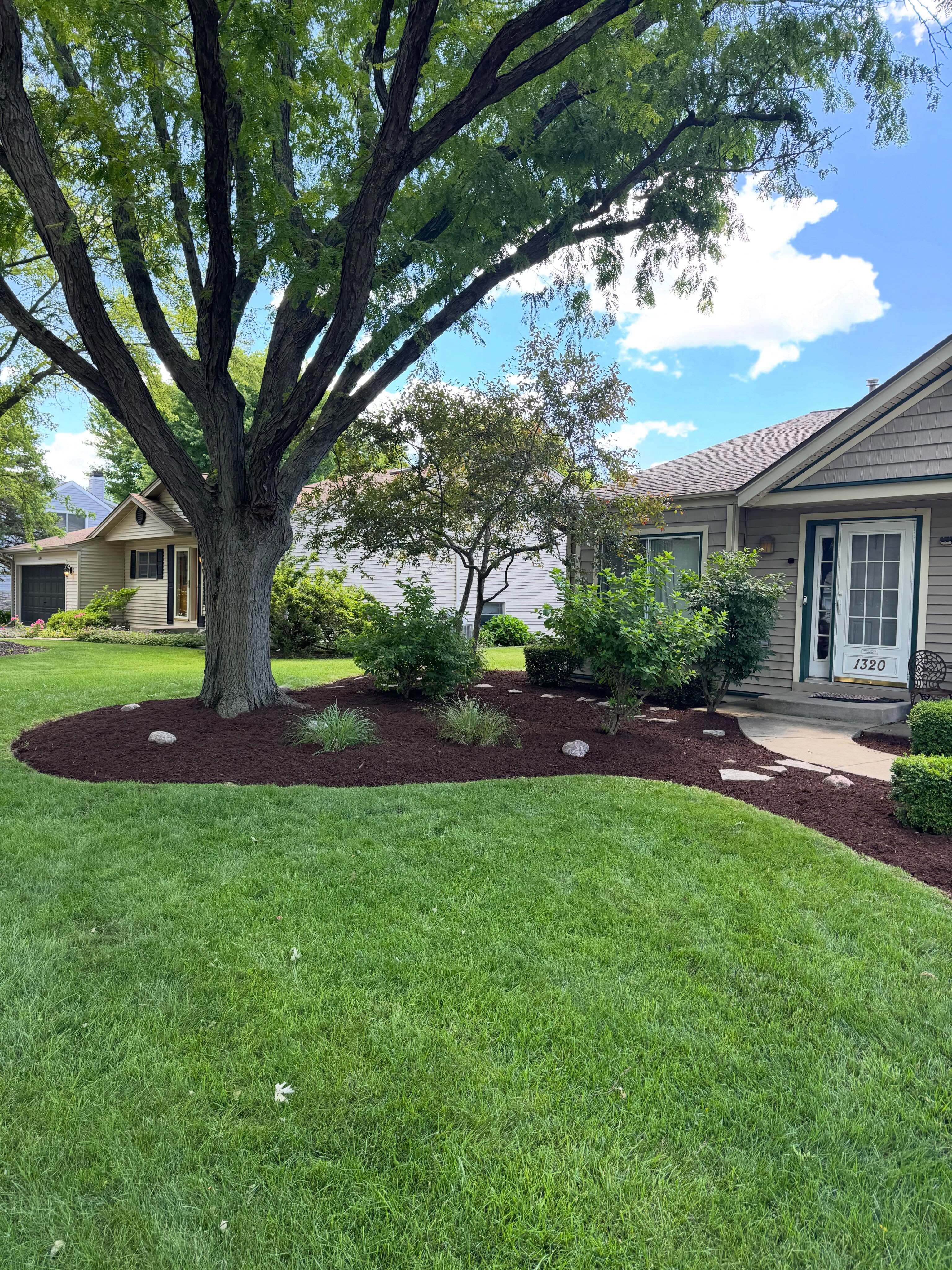 Segura's Landscaping Solutions crew working on a lawn in Bolingbrook, Illinois